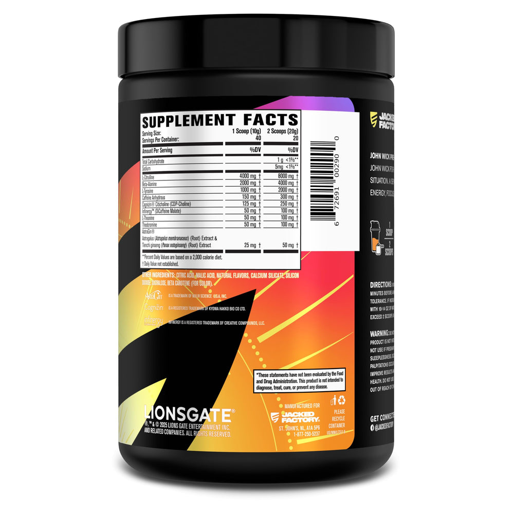 Jacked Factory Wick Mode bottle on table beside gym gear