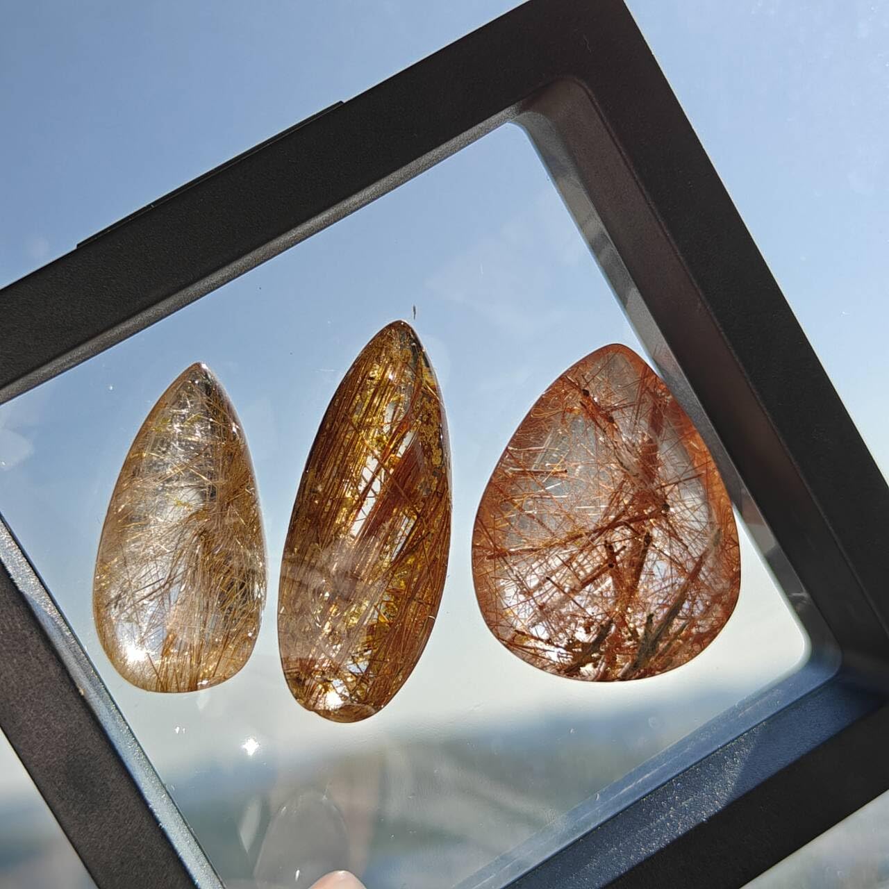 JDFlying rutilated quartz teardrop set with copper inclusions for unique accessory.
