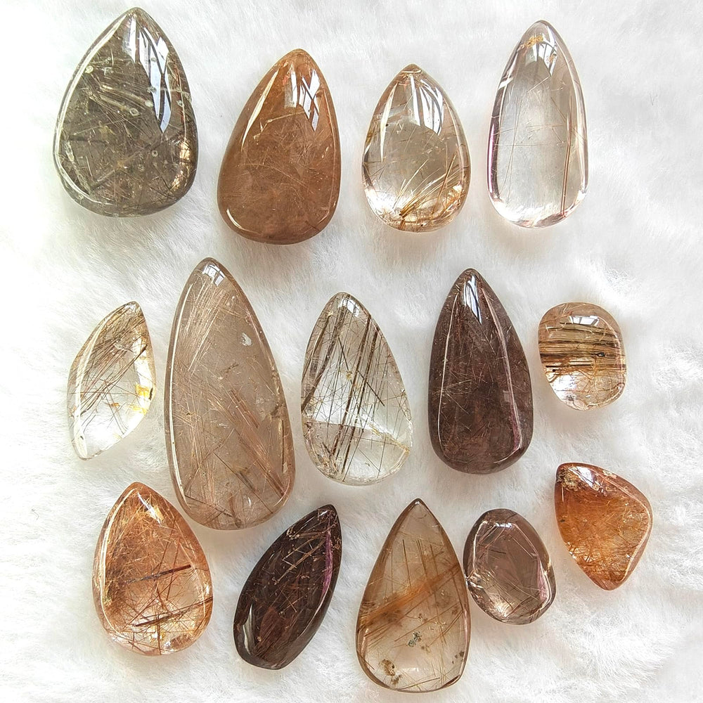 JDFlying rutilated quartz teardrop set with golden inclusions for jewelry crafting.