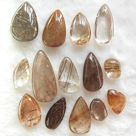 JDFlying rutilated quartz teardrop set with golden inclusions for jewelry crafting.