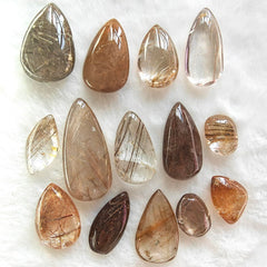 JDFlying rutilated quartz teardrop set with golden inclusions for jewelry crafting.