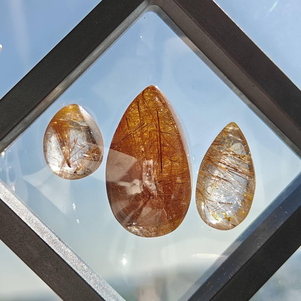 JDFlying rutilated quartz teardrop set with silver inclusions for pendant making.