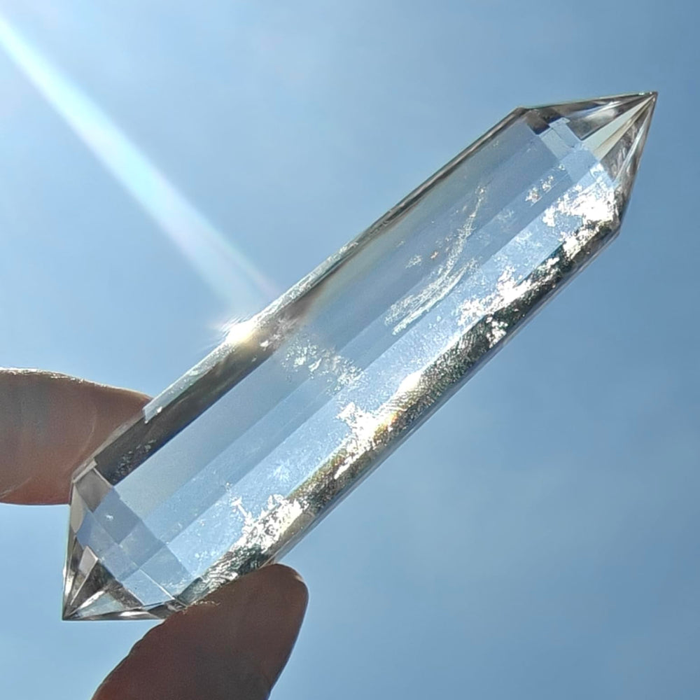 JDFlying Vogel crystal wand 90mm resting on an altar for energy alignment.