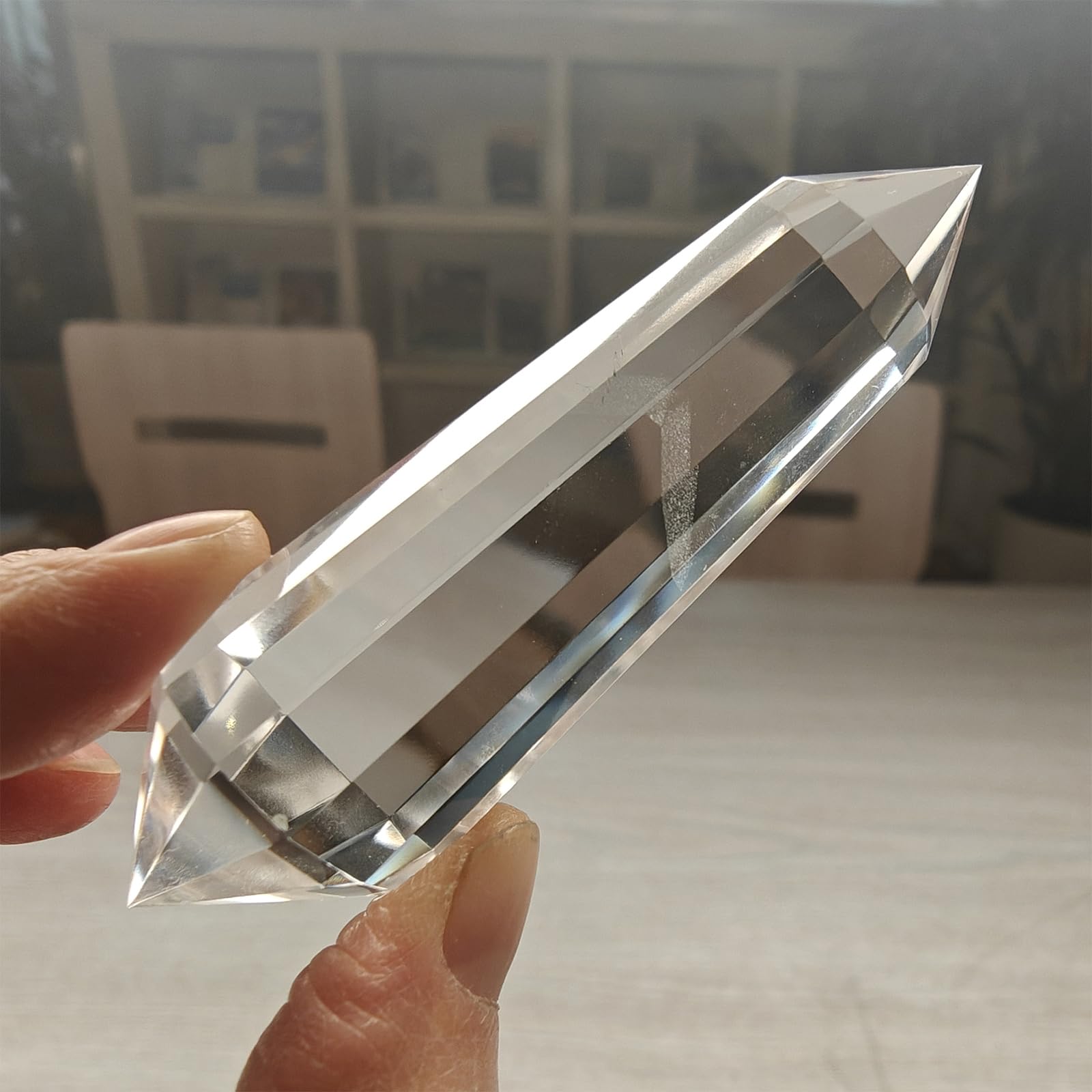 JDFlying Vogel crystal wand held during meditation to amplify focus.