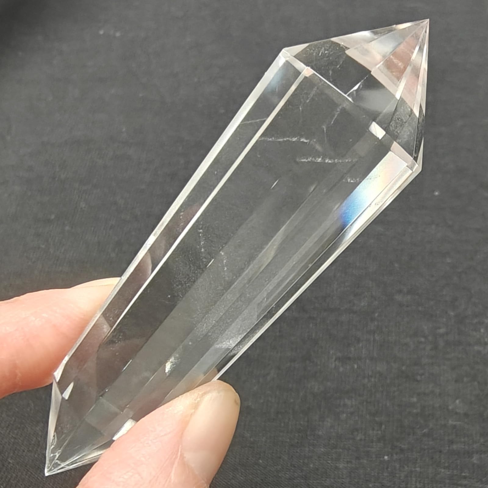 JDFlying Vogel crystal wand displayed on a shelf inviting positive energy.