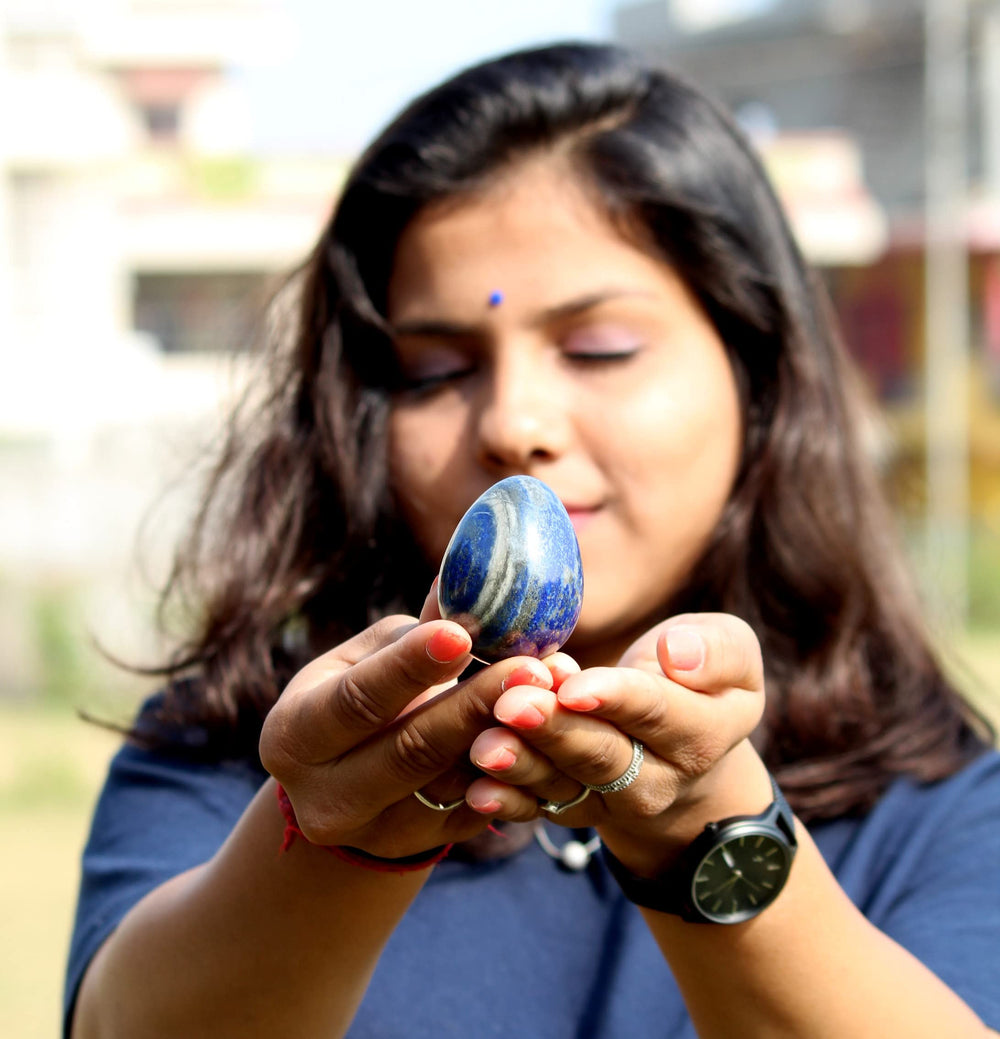 Jet International Lapis Lazuli egg on an altar, suggesting spiritual balance and calm.