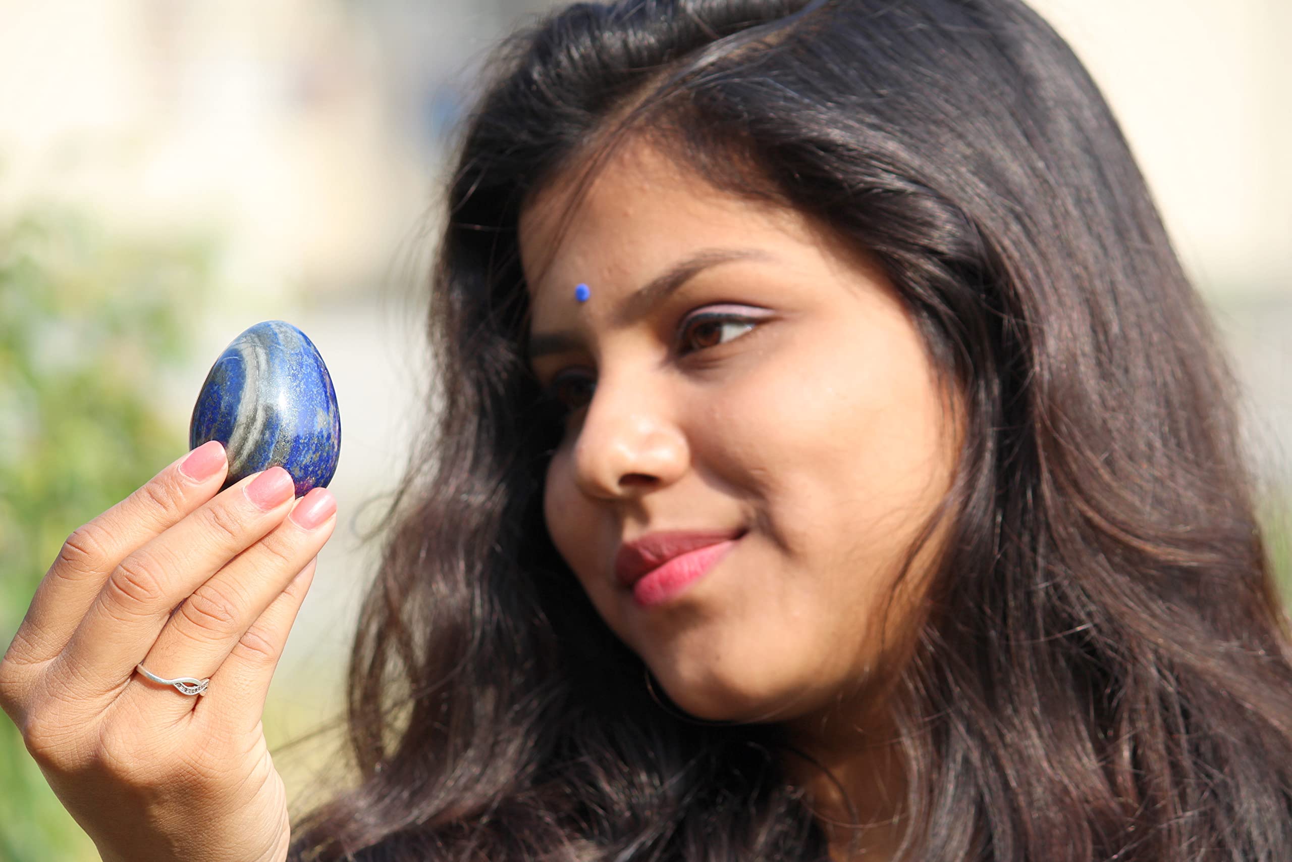 Jet International Lapis Lazuli egg close-up emphasizing Third Eye and Throat Chakra resonance.