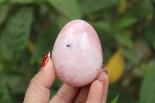 Jet International rose quartz egg close-up shows pink crystal energy.