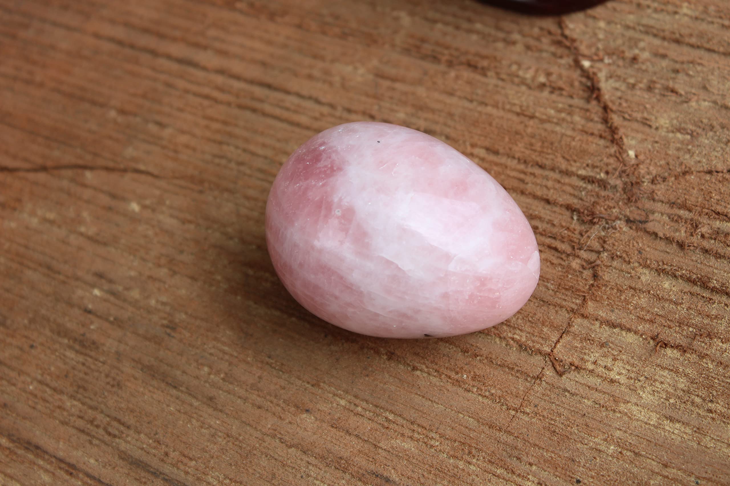 Jet International rose quartz egg used in Reiki energy healing.