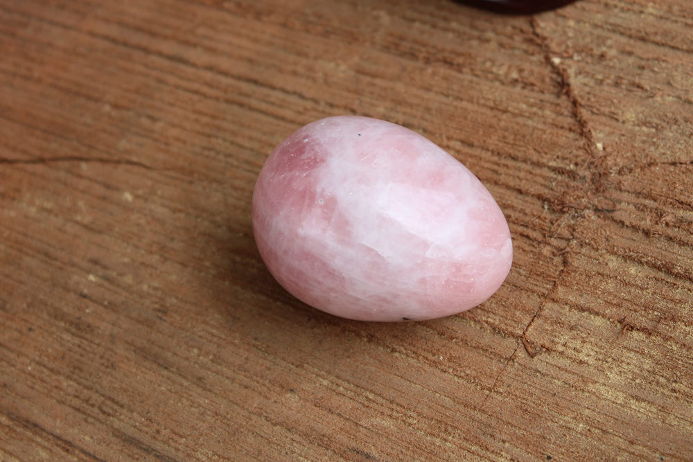 Jet International rose quartz egg used in Reiki energy healing.