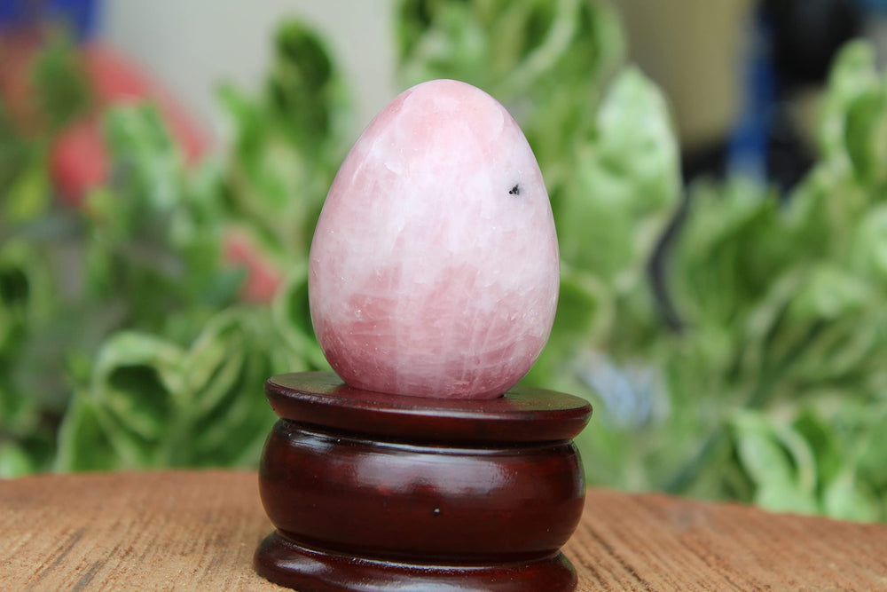 Jet International rose quartz egg in meditation space promotes calm focus.