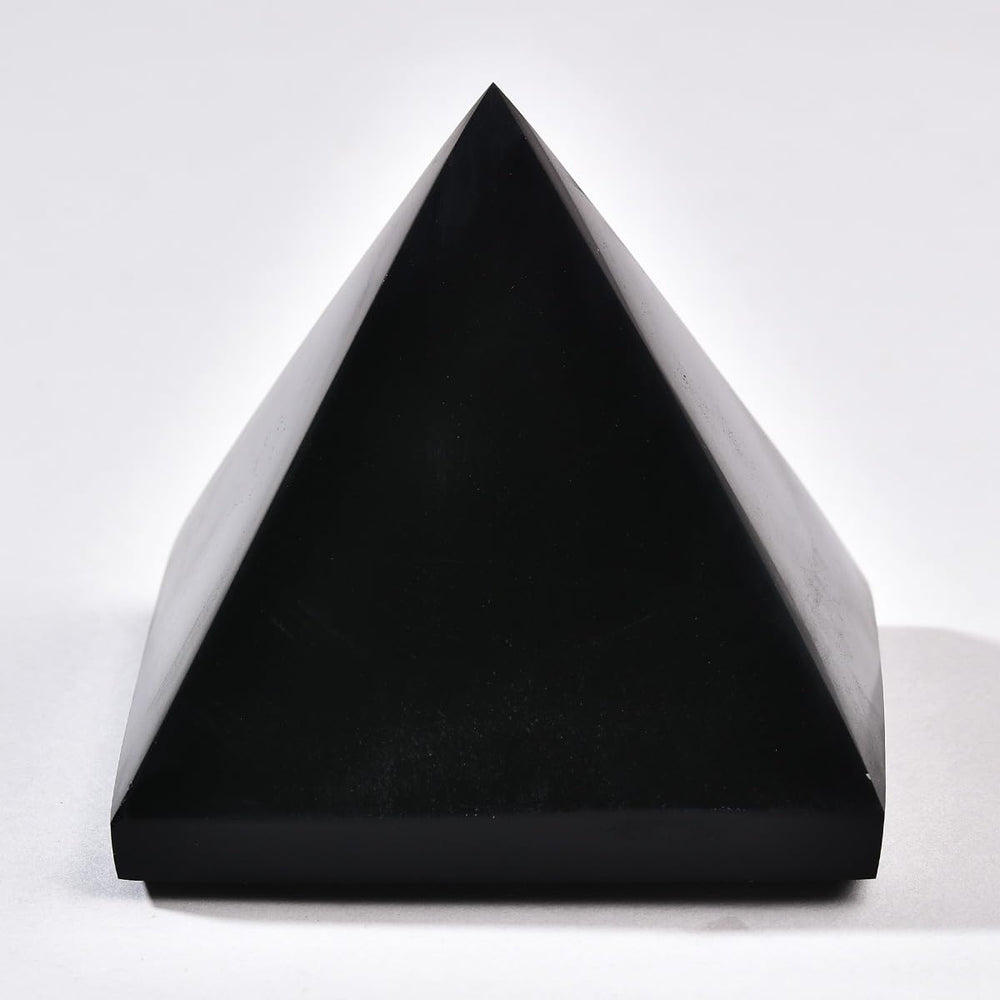 JIC Gem Black Obsidian Pyramid displayed in the living room for subtle energy.