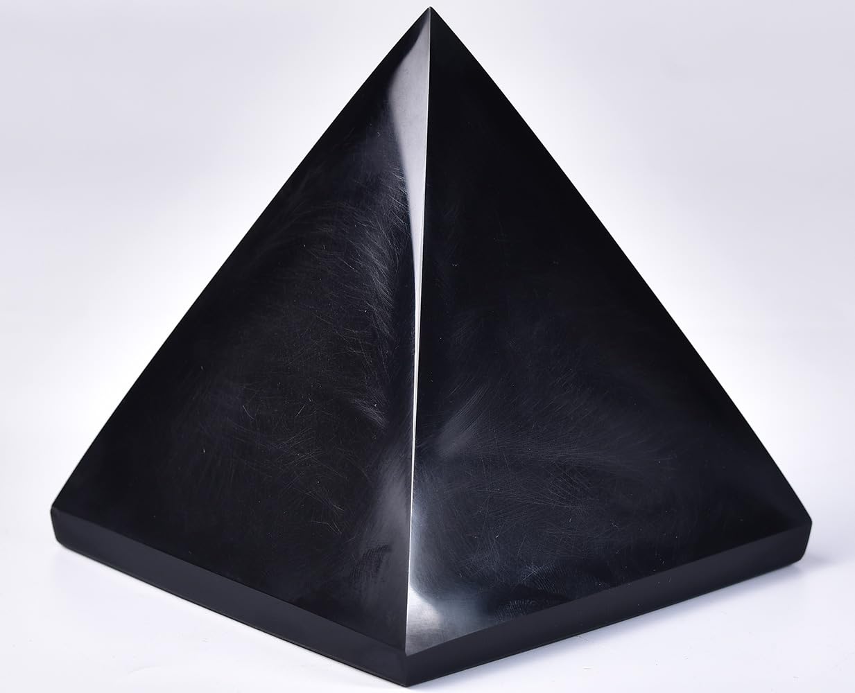 JIC Gem Black Obsidian Pyramid during meditation for focus and clarity.