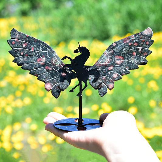JIC Gem carved angel wings sit on the stand for elegant display.