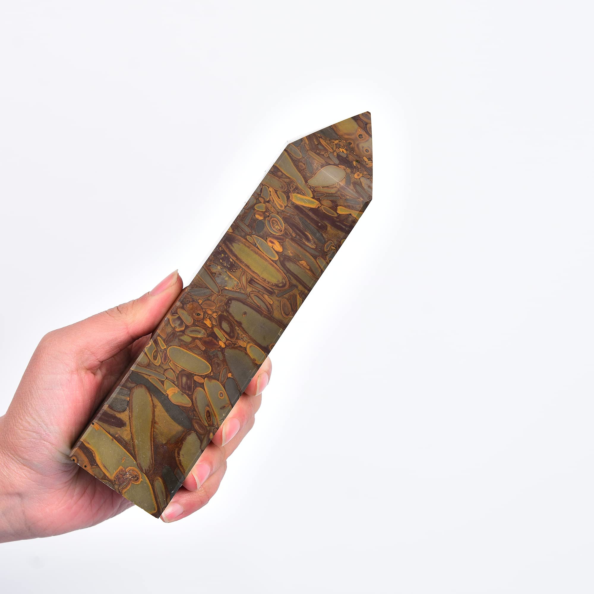 JIC Gem crystal obelisk wand enhances balance during Reiki sessions.