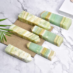 JIC Gem Caribbean calcite wand displayed as elegant home energy decor.