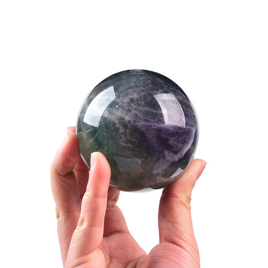 JIC Gem fluorite ball close-up displaying natural texture and vibrant color patterns.