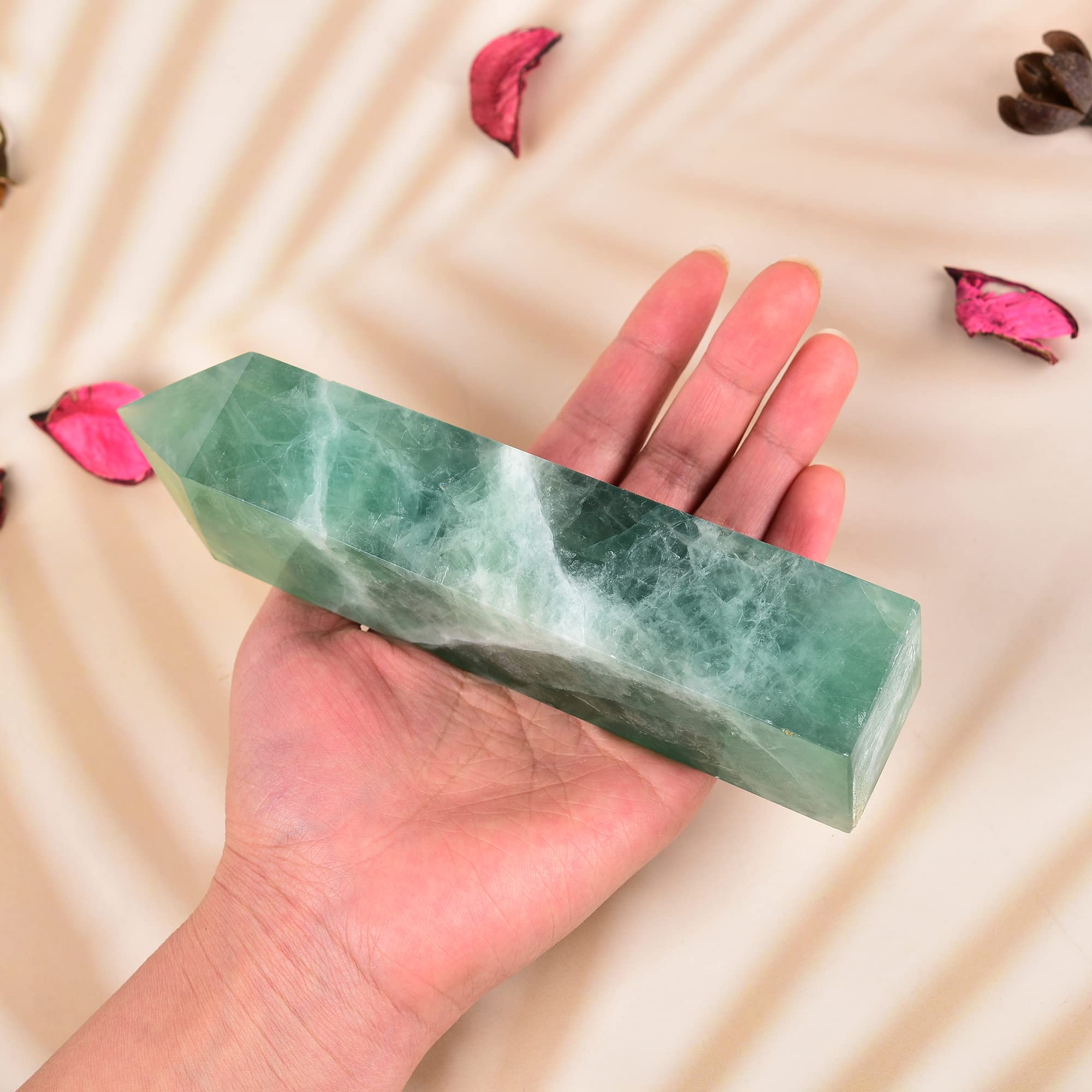 JIC Gem Green Fluorite obelisk tower in a softly lit space for focus