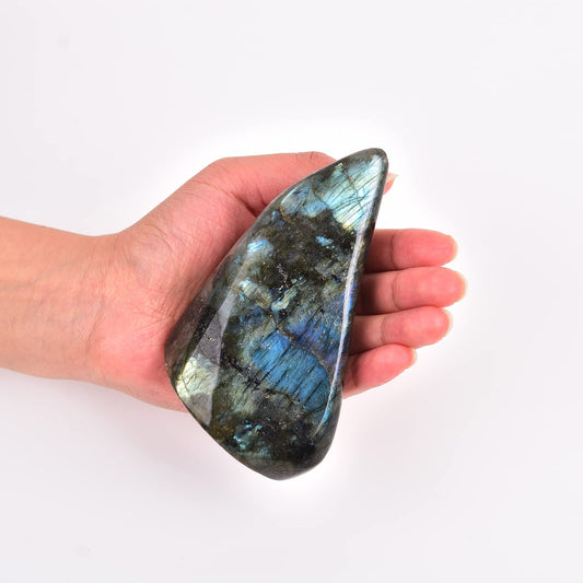 JIC Gem Labradorite palm stone shows natural color variations and character.