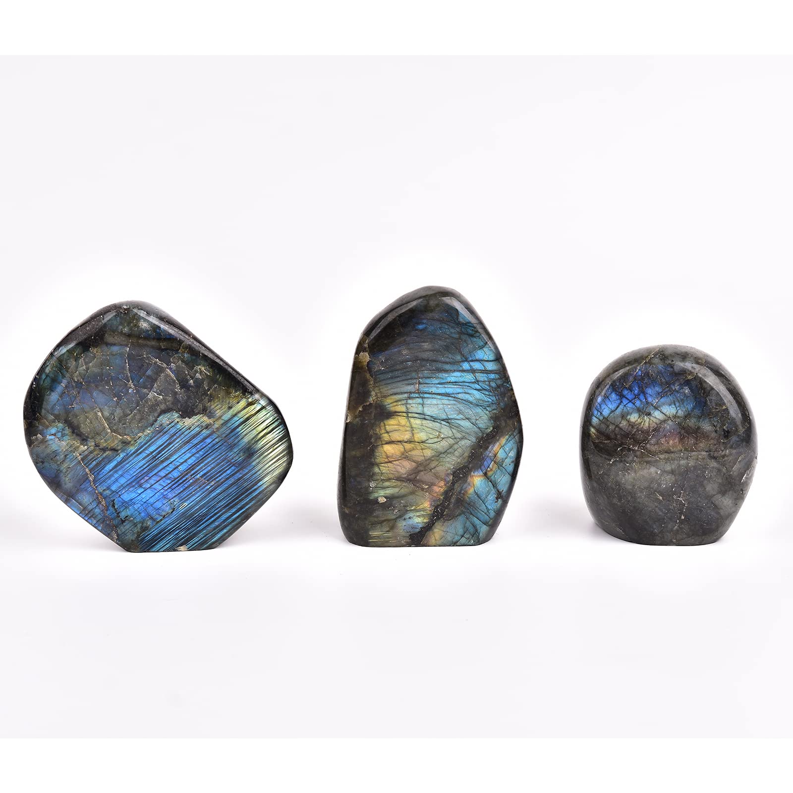 JIC Gem Labradorite palm stone sits on desk to boost energy balance.