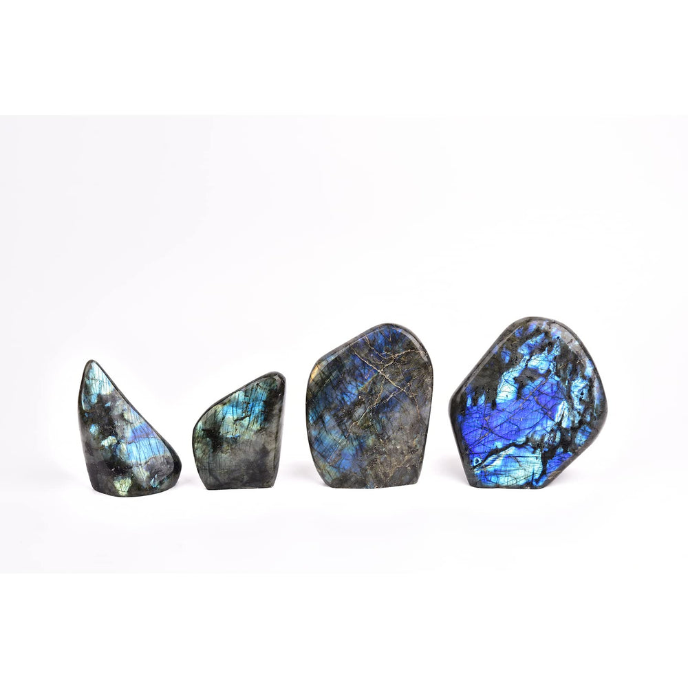 JIC Gem Labradorite palm stone in hand as a worry stone.