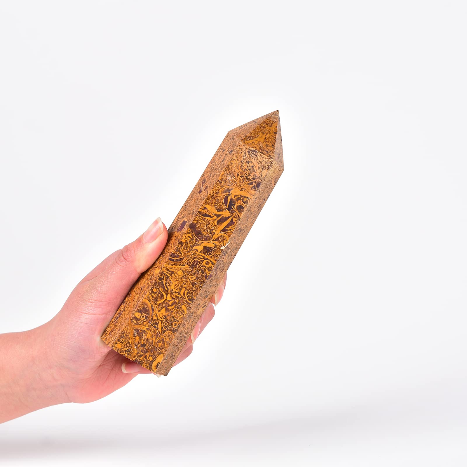 Close-up of the large obelisk wand highlighting hexagonal facets and natural uniqueness