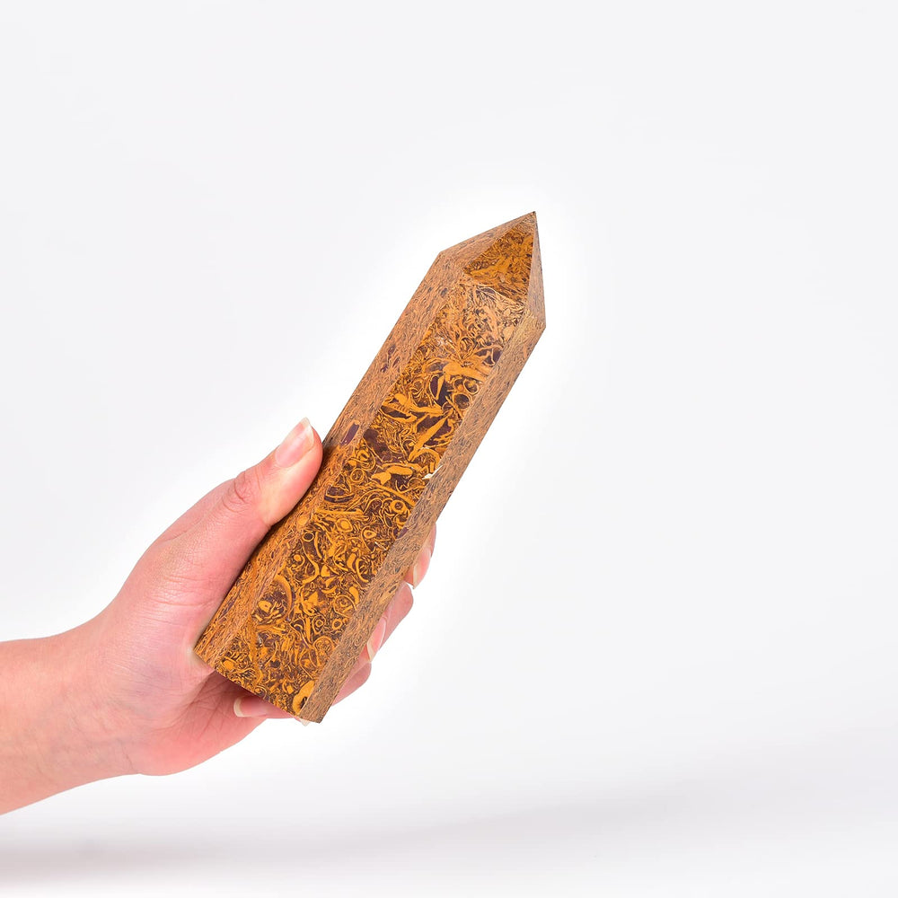 Close-up of the large obelisk wand highlighting hexagonal facets and natural uniqueness
