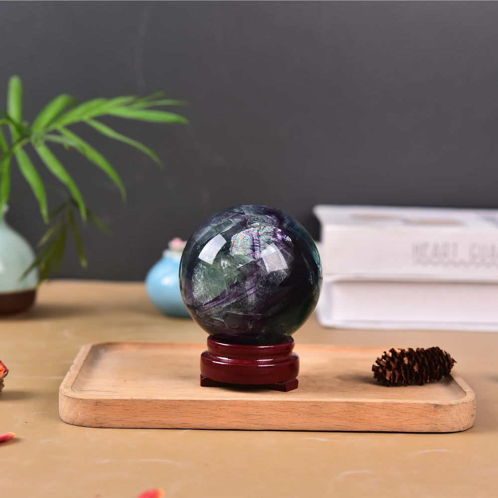 Natural fluorite sphere by JIC Gem enhances mood and decor in living spaces.