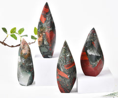 JIC Gem office/home decor crystal tower integrated on a shelf beside plants.