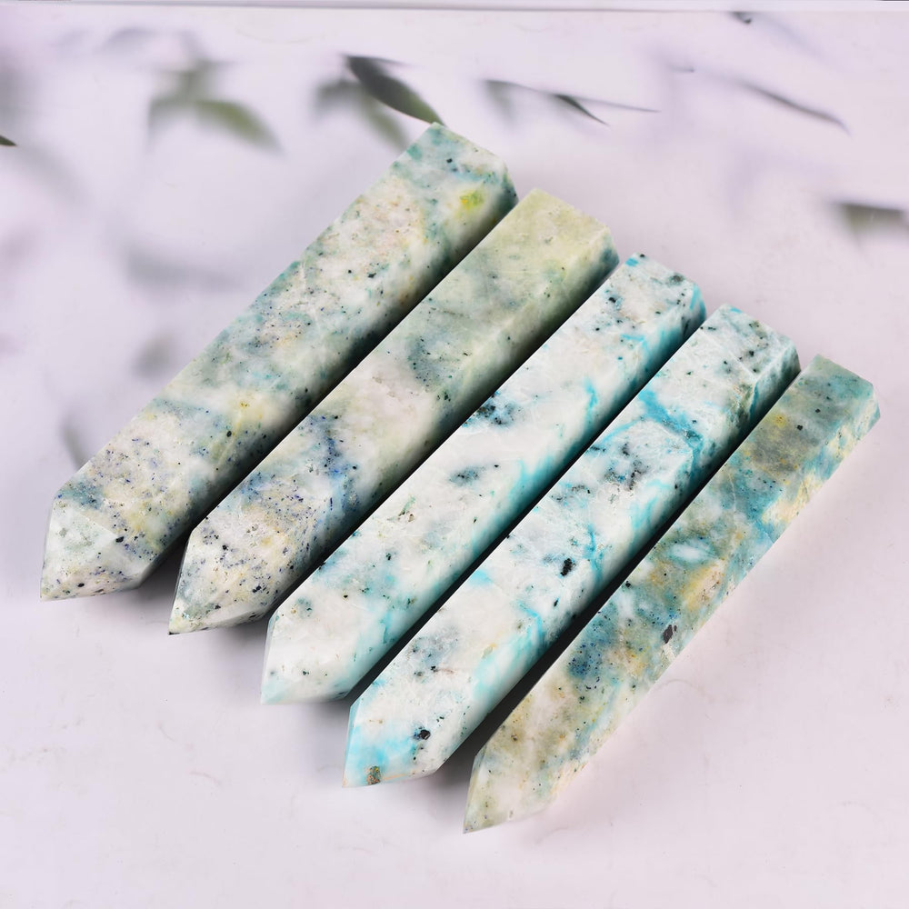 JIC Gem Phoenix Pine Quartz wand in a calm meditation setup.