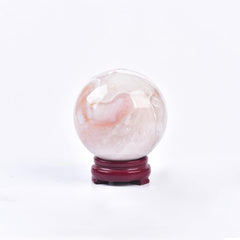 JIC Gem pink agate ball close-up reveals unique textures perfect for a focal point.