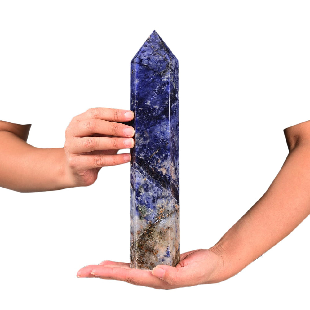 JIC Gem six-faceted blue sodalite wand as an energy focal point during crystal work.