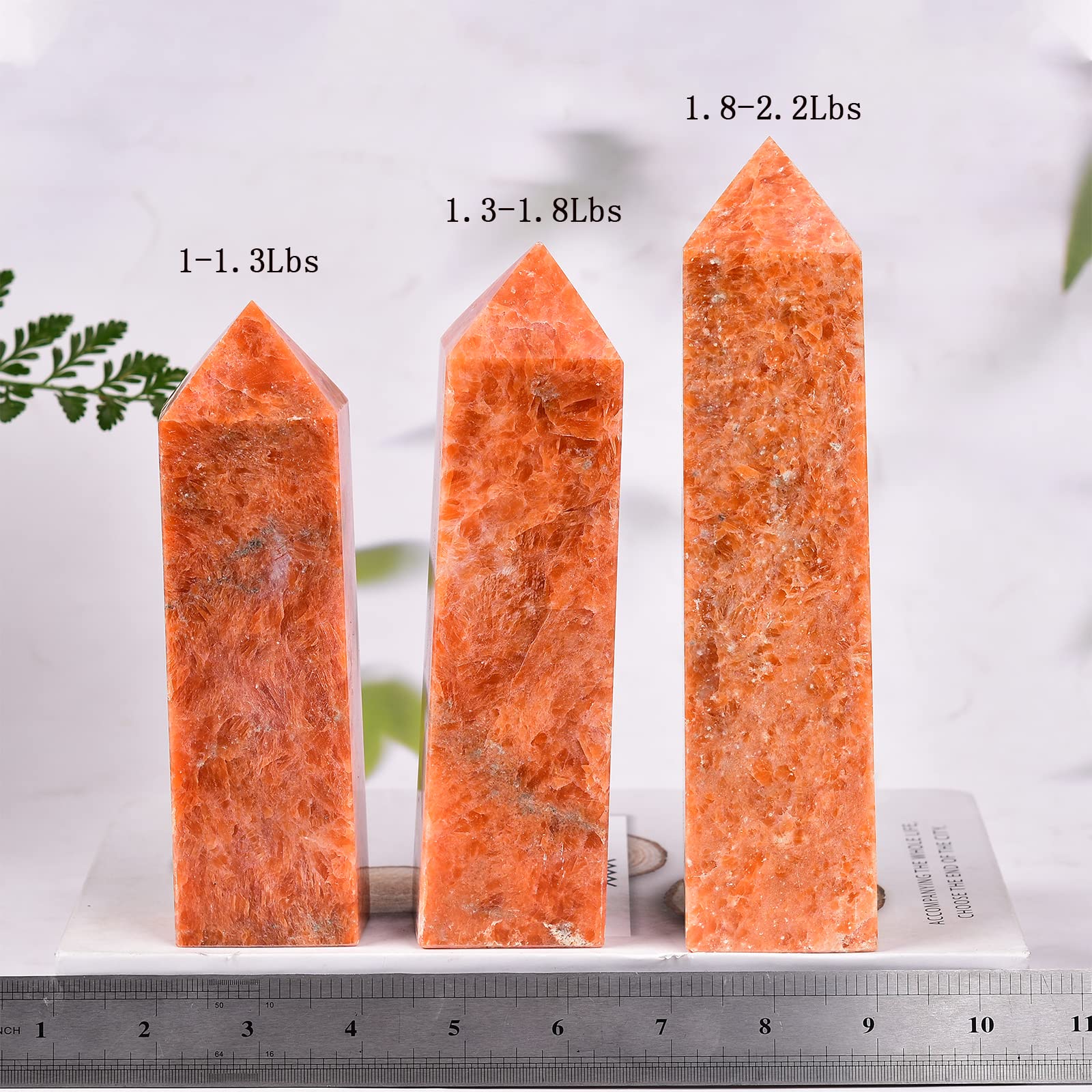 JIC Gem Sunstone obelisk tower held in hand for size reference and energy use