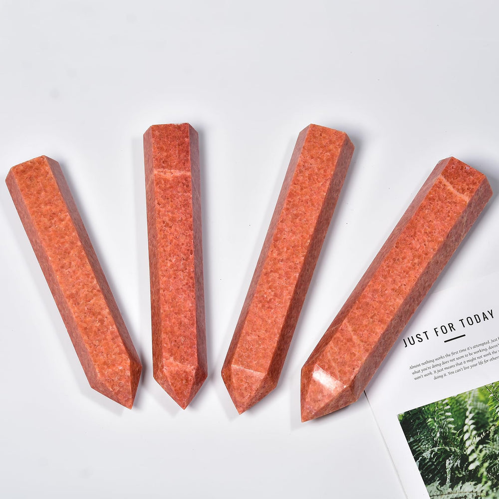 JIC Gem Sunstone Wand polished surface in hand for meditation and focus