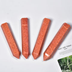 JIC Gem Sunstone Wand polished surface in hand for meditation and focus