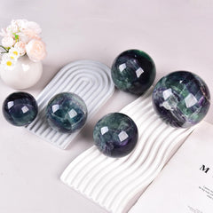 Yellow-green fluorite ball from JIC Gem brightens desks and offices.