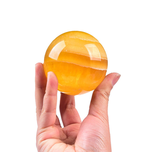 JIC Gem yellow fluorite crystal sphere close-up glow promotes calm focus.