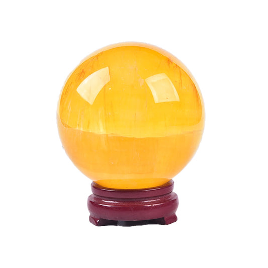 JIC Gem yellow fluorite sphere on wooden stand, showcasing natural texture for calm decor.