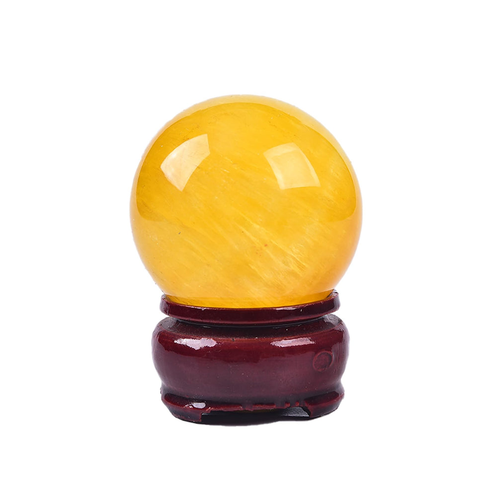 Close-up of JIC Gem yellow fluorite sphere showing natural color patterns