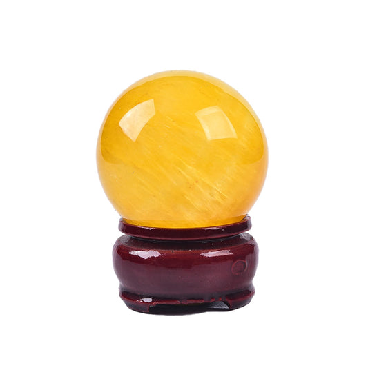 Close-up of JIC Gem yellow fluorite sphere showing natural color patterns