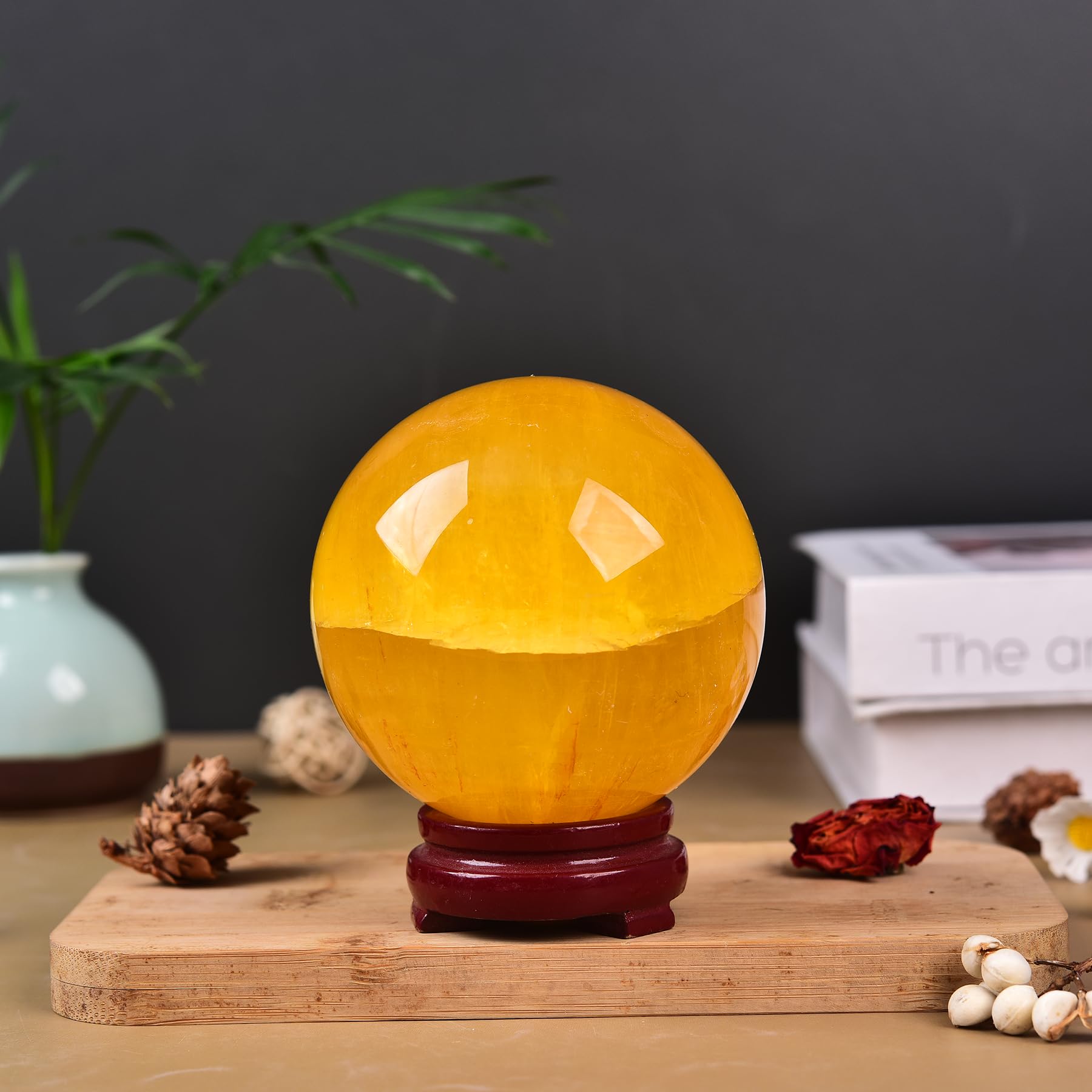 JIC Gem yellow fluorite sphere on stand used as a desktop display centerpiece.