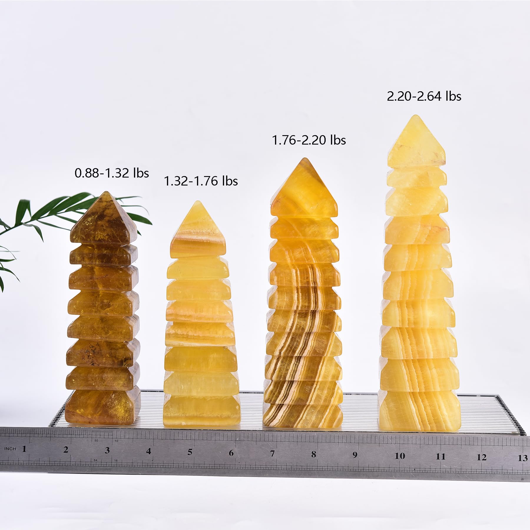 JIC Gem Fluorite Tower under light casts soft glow on a desk.