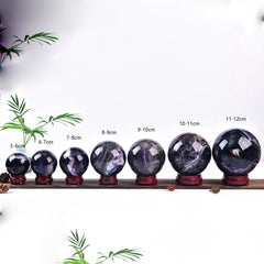 Fluorite ball with stand adds harmony to witchcraft and Reiki practices.