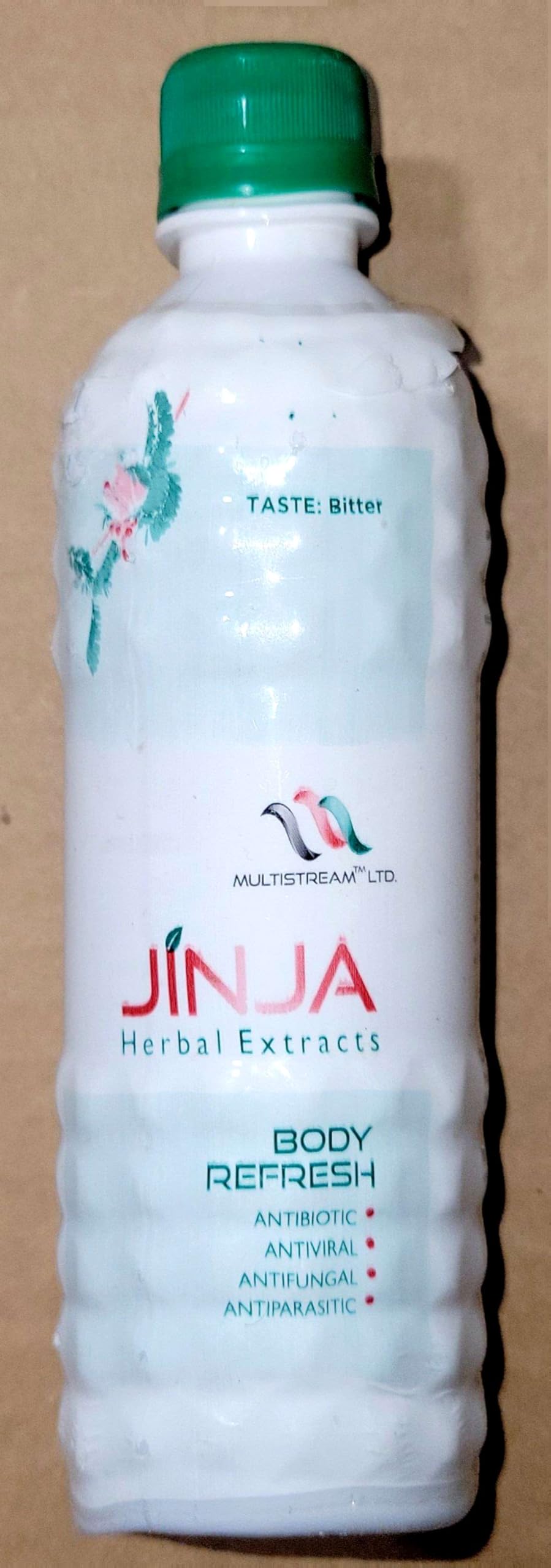 Natural ingredients of Jinja Herbal Extract illuminated in the bottle