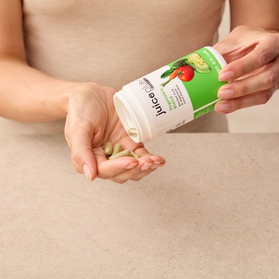 Juice Plus+ Vegetable Blend green powder ready to blend into drinks.