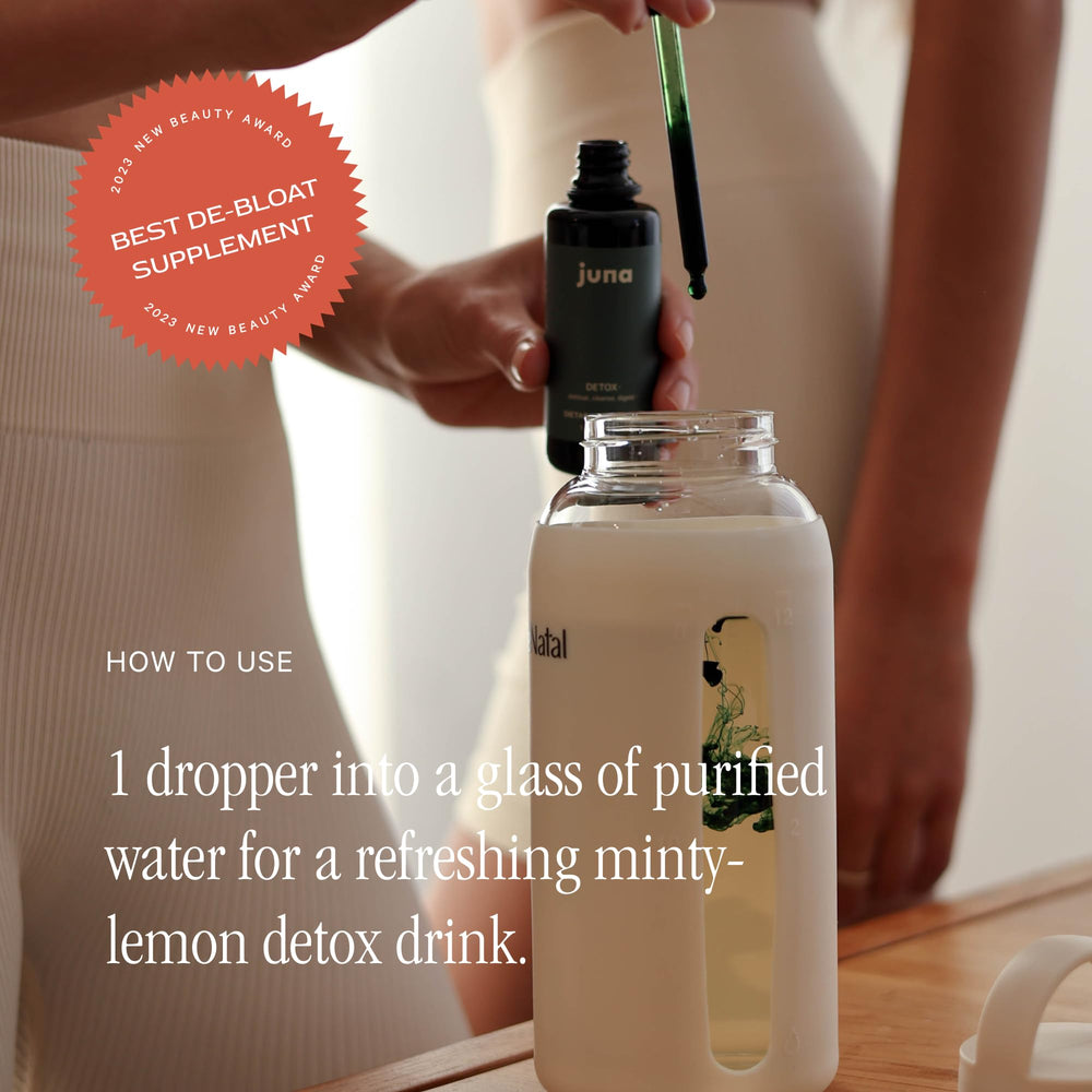 Glass of water with Juna Drops offers a clean spa-water taste.