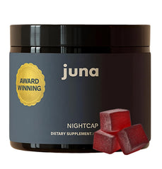 Juna Nightcap Sleep Gummies bottle on a nightstand promotes a calming bedtime routine.