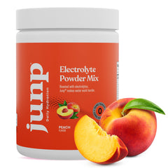 JUNP peach flavor dissolving in water for a refreshing keto hydration boost