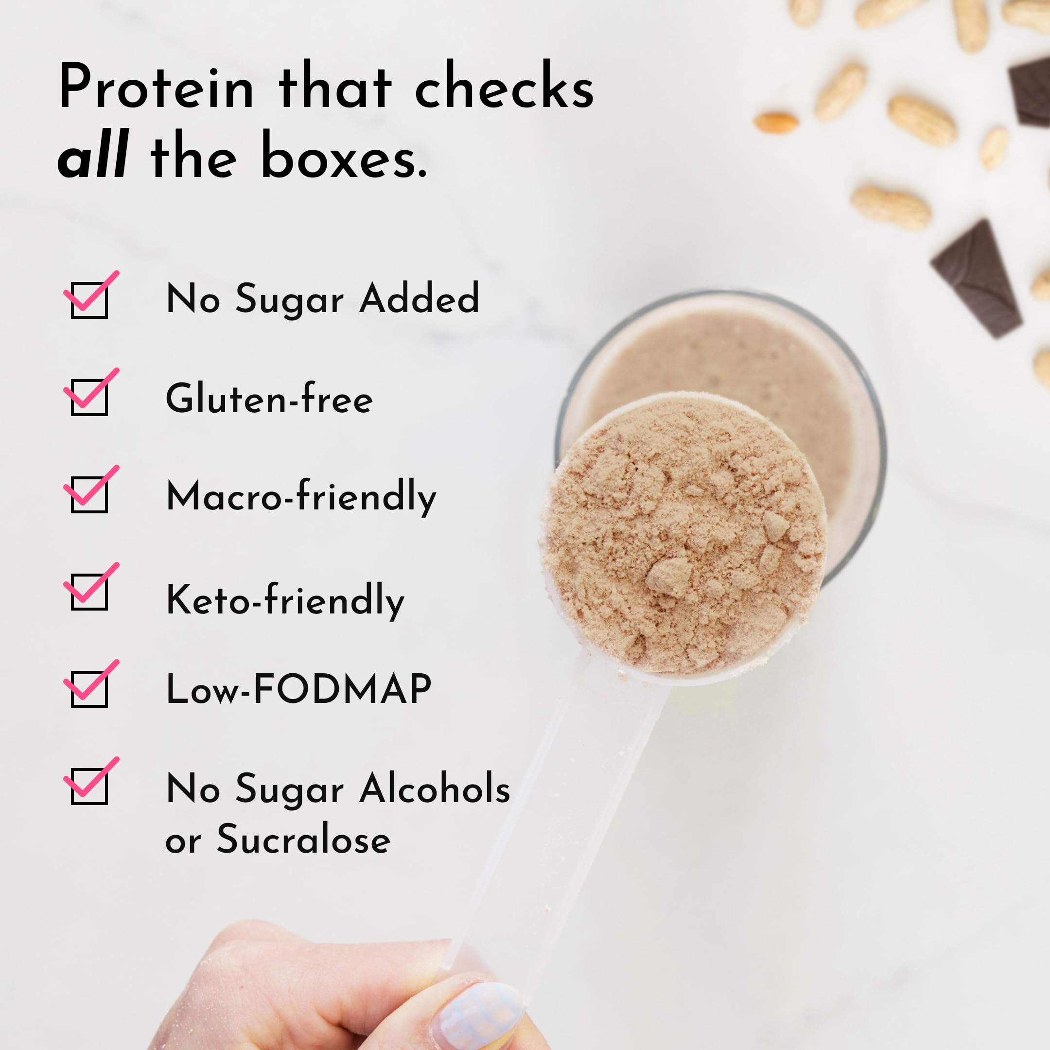 Glass of protein shake with JUST INGREDIENTS powder and deep cocoa aroma
