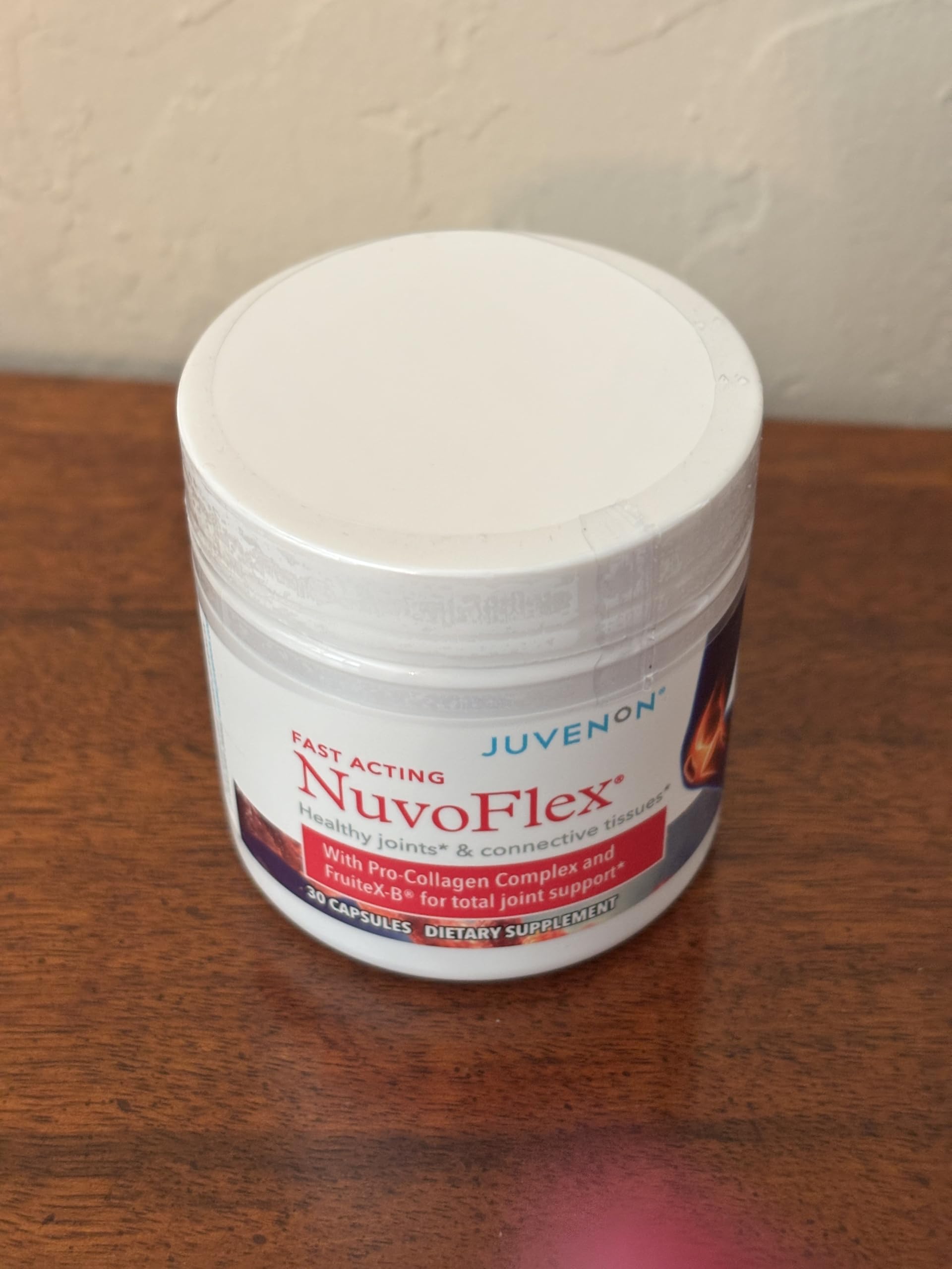 Juvenon NuvoFlex bottle on desk—simple daily supplement routine.